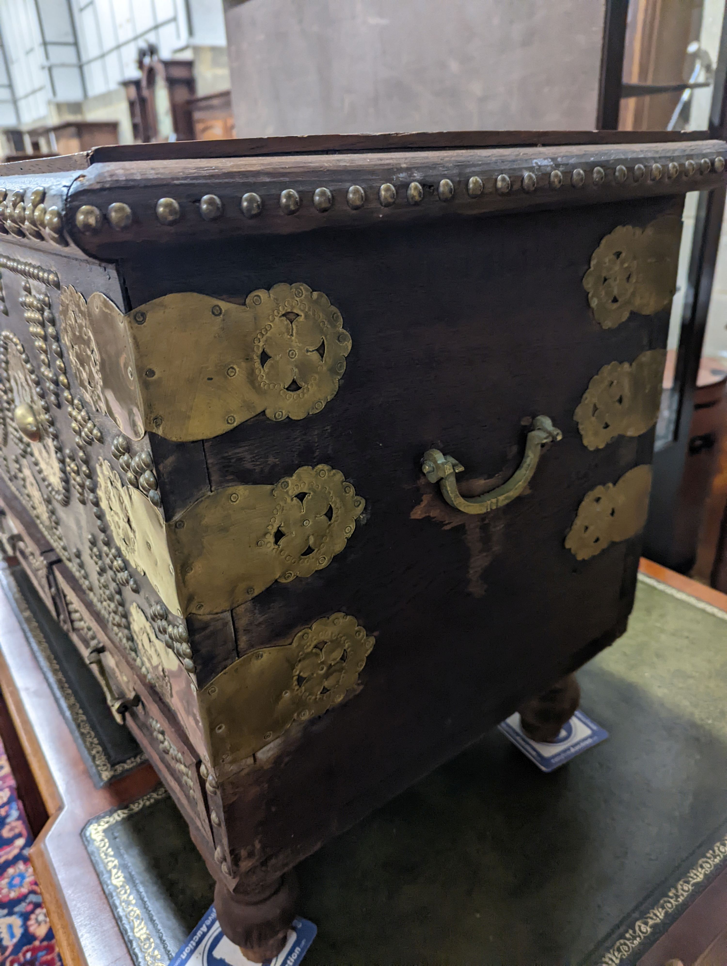 An Eastern brass mounted and studded hardwood trunk, length 113cm, depth 48cm, height 60cm